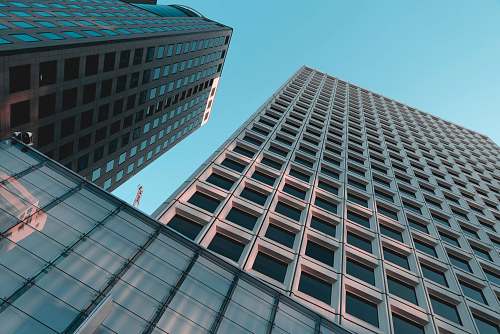 office building low angle photography of glass highrise building architecture
